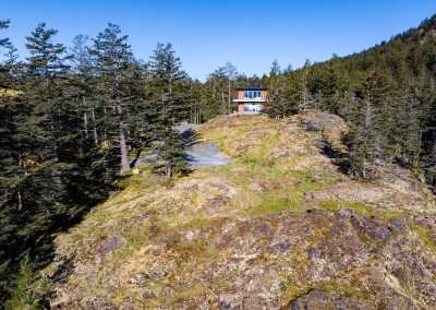 Kaplan Homes custom home overlooking rocky Pacific Northwest coastline