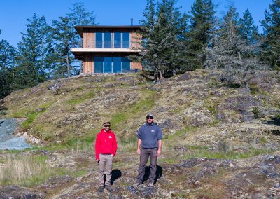 vertical siding house with builders out front